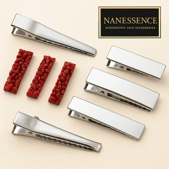 Set of silver alligator hair clips and textured red hair accessories on beige background