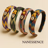 Colorful Afrocentric headbands with zigzag patterns, cowrie shells, and beaded accents.