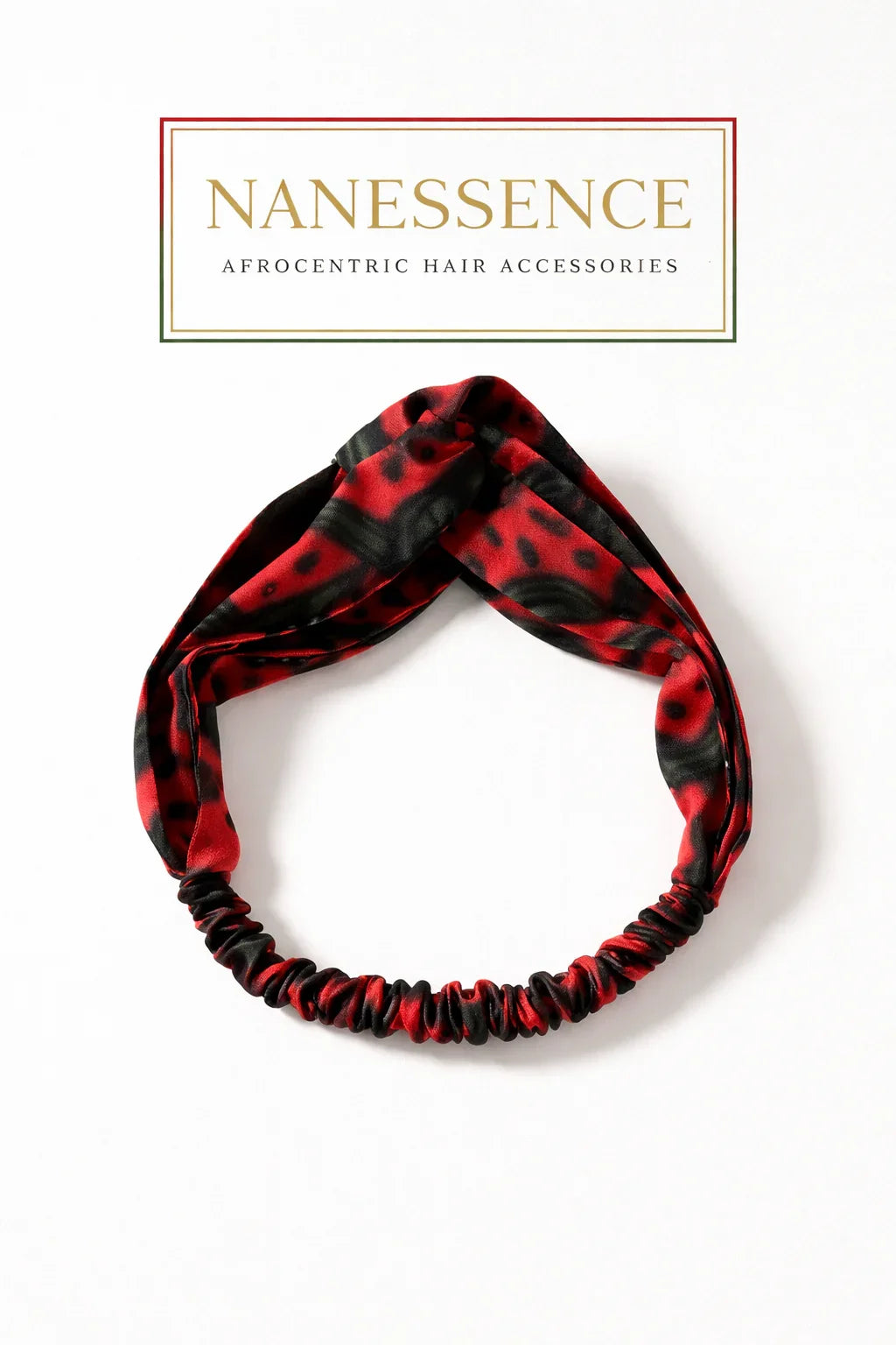Red and black Afrocentric patterned twisted headband on white background