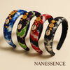 Colorful Afrocentric headbands with cowrie shells, beads, buttons, and tie-dye patterns.