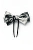Black and silver satin bow hair accessory with double prong clip on white background