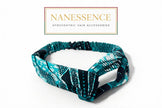 Blue and black Afrocentric patterned fabric headband on white background, stylish hair accessory.