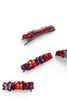 Colorful Afrocentric butterfly hair clips with red stones on white background