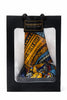 Gift bag with vibrant Afrocentric patterned fabric in orange, blue, and black colors