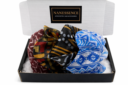 Set of colorful Afrocentric patterned satin scrunchies in a gift box labeled Afrocentric hair accessories