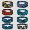 Set of eight colorful Afrocentric patterned fabric headbands with twisted knot design