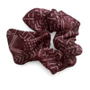 Maroon silk scrunchie with Afrocentric geometric patterns, fashion hair accessory
