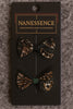 Afrocentric hair bow accessories with bold tribal patterns on display card
