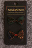 Afrocentric patterned hair bows set on black card, vibrant green and red prints