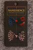 Set of two Afrocentric patterned bow hair clips with colorful polka dots on display card