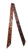 Afrocentric tie with bold orange mosaic and black abstract patterns, modern fashion accessory