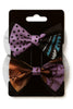 Set of two Afrocentric bow hair clips with bold purple, brown, and patterned designs