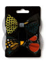 Two Afrocentric print hair bows with colorful geometric patterns on display card