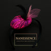 Afrocentric pink patterned fascinator with black and pink feathers on black headband