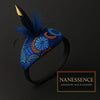 Afrocentric headband with vibrant blue and orange pattern, adorned with blue and gold feathers