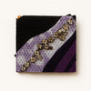Handcrafted Afrocentric clutch with purple, black, and white fabric, crystal embellishments