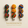 Colorful Afrocentric fabric hair clips with bold geometric and swirl patterns, three designs.