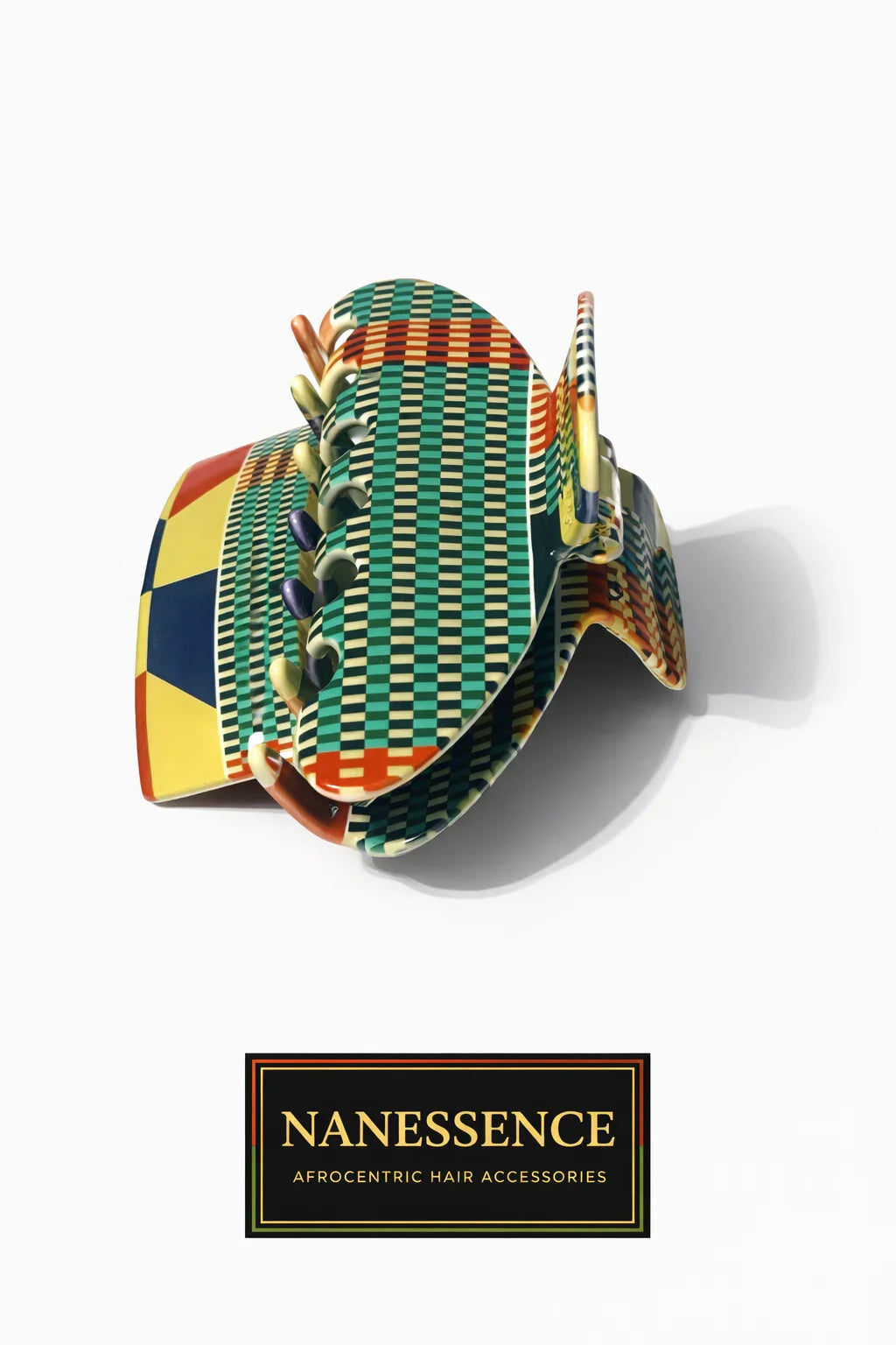 Colorful Afrocentric patterned hair claw clip with geometric and checkered designs on white background.