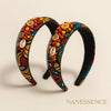 Colorful Afrocentric headbands with vibrant patterns, shells, beads, and button embellishments.