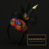 Afrocentric headband with bold geometric patterns, black feathers, and a mesh bow on black background